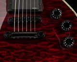 Close up of a red electric guitar.