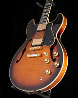 Yamaha SA2200-OVS Semi-Hollow guitar in Violin Sunburst. Features include dual humbucker pickups, gold hardware, and a black pickguard. The body has a flamed maple top with f-holes.