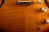 Close-up of a Yamaha SA2200-OVS Semi-Hollow guitar in Violin Sunburst. Visible are the wood grain, control knobs, and part of the bridge.