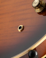 Close-up of a Yamaha SA2200-OVS Semi-Hollow guitar in Violin Sunburst. Features include a tone knob, input jack, and gold hardware.