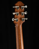 The back of a Yamaha SLG200S Silent Guitar in Trans Black. The focus is on the headstock, featuring six chrome tuning pegs on a wooden neck.