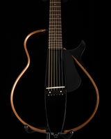 Yamaha SLG200S Silent Guitar in Trans Black, featuring a sleek body design with a rosewood frame, six strings, and a black pickguard.