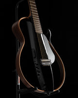 Yamaha SLG200S Silent Guitar in Trans Black, featuring a sleek body design, rosewood frame, and control panel with volume and tone knobs.