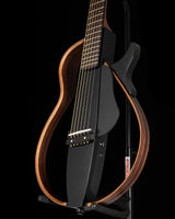 Yamaha SLG200S Silent Guitar in Trans Black, featuring a sleek, modern design with a detachable frame and steel strings.