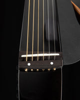 Yamaha SLG200S Silent Guitar in Trans Black, featuring a sleek, modern design with a detachable frame and steel strings.