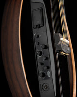 Yamaha SLG200S Silent Guitar in Trans Black, featuring a sleek body, control panel with volume and tone knobs, and a headphone jack.